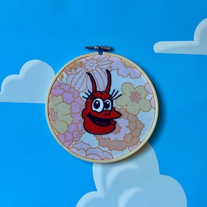PINCHY - Arte de pared con bastidor de bordado floral de Los Simpsons