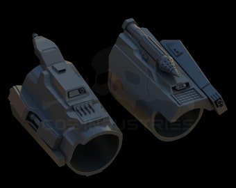 May include: Two gray 3D printed futuristic arm attachments. One has a small missile on top and the other has a series of small holes.