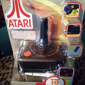 Classic Atari Plug n Play - Quién quiere ser millonario - Monopoly Jr. - Apples to Apples - Clue Jr. Juegos de mesa