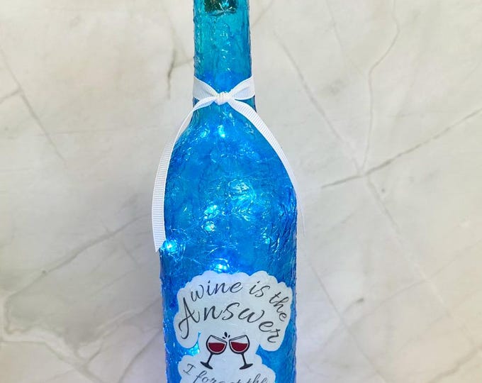 Funny wine sayings. Wine is the answer I forget the question. Lighted bottle with fairy lights. Lightup bottles with funny wine sayings.