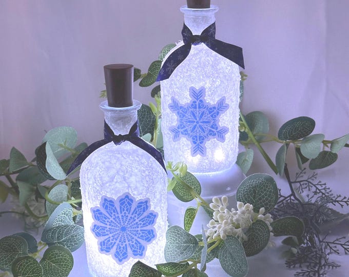 Snowflake lightup bottles. Lighted bottle snow flake bottles. Snowflake stickers.  Cute Christmas Decoration Winter theme decor. Holiday