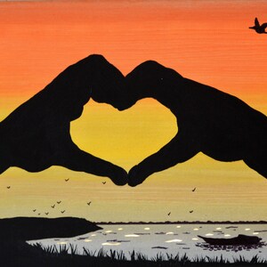 Led canvas art 'Hands in heart on sunset' image 1