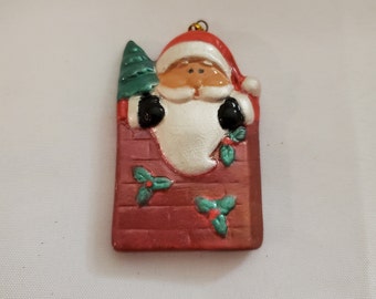 A miniature Santa in the chimney Tree ornament