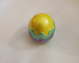A colorful Easter egg, with a wavy design.