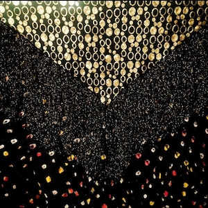 May include: Black fabric with a gold circle pattern, a black fabric with a glitter pattern, and a black fabric with a white and red polka dot pattern.