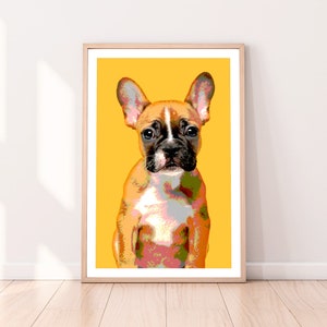 May include: A framed print of a French bulldog puppy with a yellow background. The puppy is sitting and looking directly at the viewer. The puppy's fur is brown, white, and black.