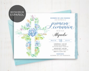 May include: A white invitation card with a watercolor illustration of a cross decorated with blue and green flowers. The text "INVITACIÓN EN ESPAÑOL" is at the top of the card. The text "primera comunión" is in a decorative script font. The text "DE SU HIJO Alejandro" is below the script font. The text "MAYO 18 2019" is below the name. The text "CEREMONIA - 0:00 AM Nombre de la Iglesia 123 Avenida alegre Cuidad, ES" is below the date. The text "RECEPCIÓN - 0:00 PM 123 Avenida alegre Cuidad, ES RSVP Mia 1322816-0084" is below the ceremony information. The text "PADRINOS NOMBRE DE LOS PADRINOS" is at the bottom of the card.