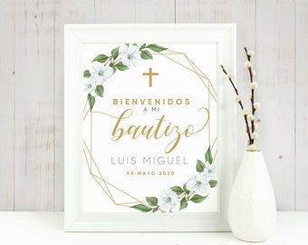 May include: A white printable sign with a gold geometric frame and white flowers. The text reads "Bienvenidos a mi bautizo Luis Miguel 05-Mayo-2020".