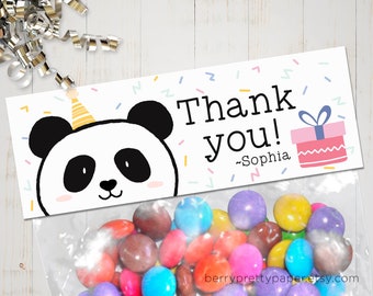 May include: A white thank you favor bag with a panda bear wearing a party hat. The bag has confetti and the text "Thank you! -Sophia" printed on it. The bag is filled with colorful candy.