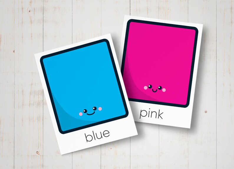 May include: Two colourful squares with happy faces. The blue square says "blue" and the pink square says "pink".