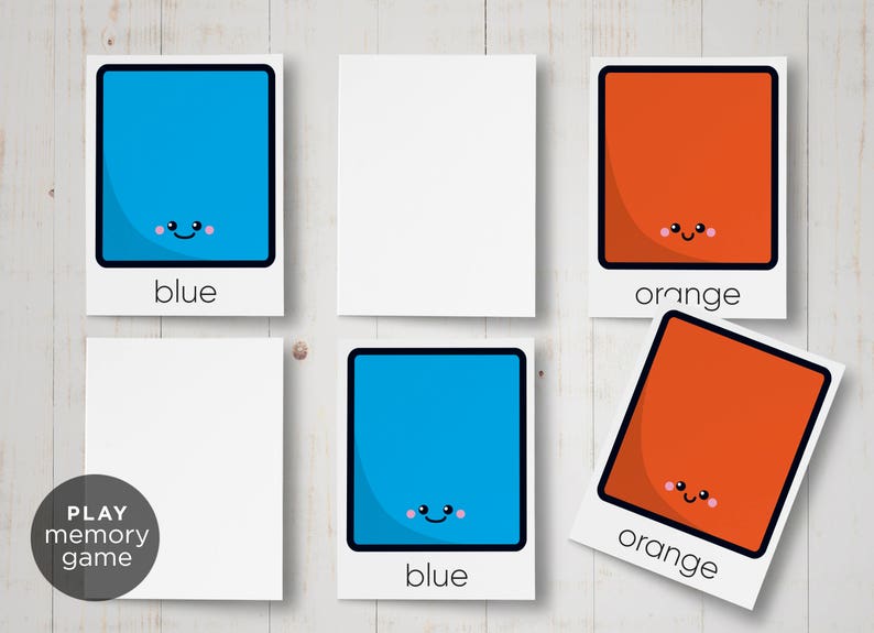 May include: A set of six cards for a memory game. The cards feature blue and orange squares with happy faces. The words "blue" and "orange" are printed below each square.