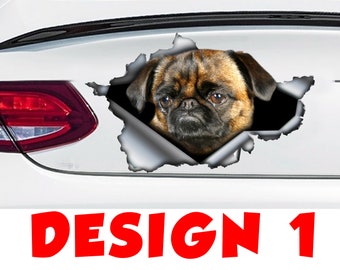 Peut inclure: Un chien griffon bruxellois brun et noir sort d'un morceau de papier déchiré sur une voiture blanche. Le chien a une expression sérieuse et regarde directement la caméra. Le texte "DESIGN 1" est imprimé sous l'image.