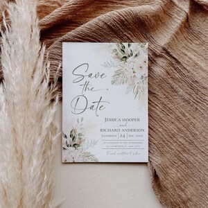 May include: Save the date card with a watercolor floral design. The card features the text "Save the Date" in a cursive font, followed by the names Jessica Hooper and Richard Anderson, the date Saturday, September 24, and the time at 1 o'clock in the afternoon. The card also includes the address 123 Anywhere St, Any City.