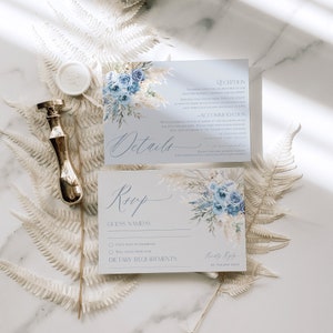 May include: Blue and white wedding invitation with a floral design. The invitation includes details about the reception, accommodation, and RSVP information. The RSVP card includes a section for guest names, dietary requirements, and a choice of "Can't wait to celebrate" or "Will toast from afar".