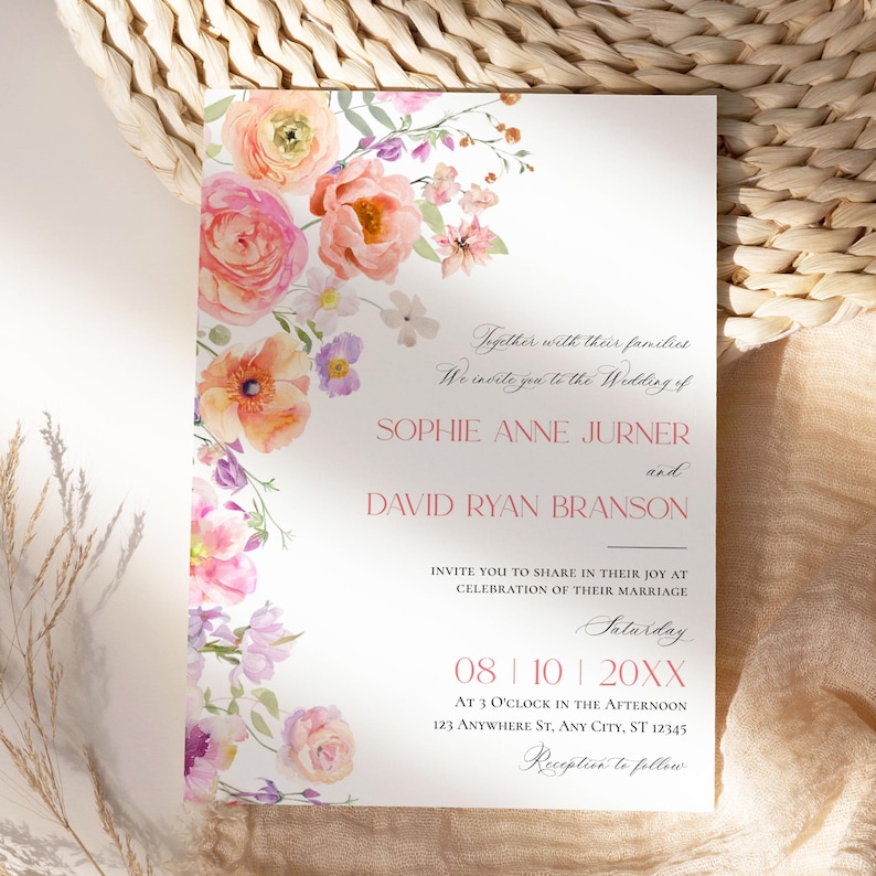 May include: A white wedding invitation card featuring a watercolor floral border of pink, orange, and purple flowers. The text reads: Together with their families, We invite you to the Wedding of SOPHIE ANNE JURNER and DAVID RYAN BRANSON.