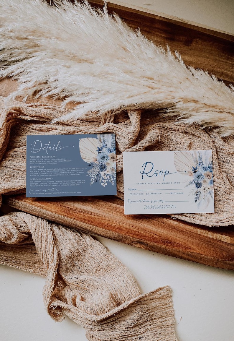 May include: Blue and white wedding RSVP card with a floral design and the text "RSVP Kindly Reply by August 25th". The card includes a section for the guest's name, a choice of attending or not attending, and a space to indicate if they will be staying overnight.