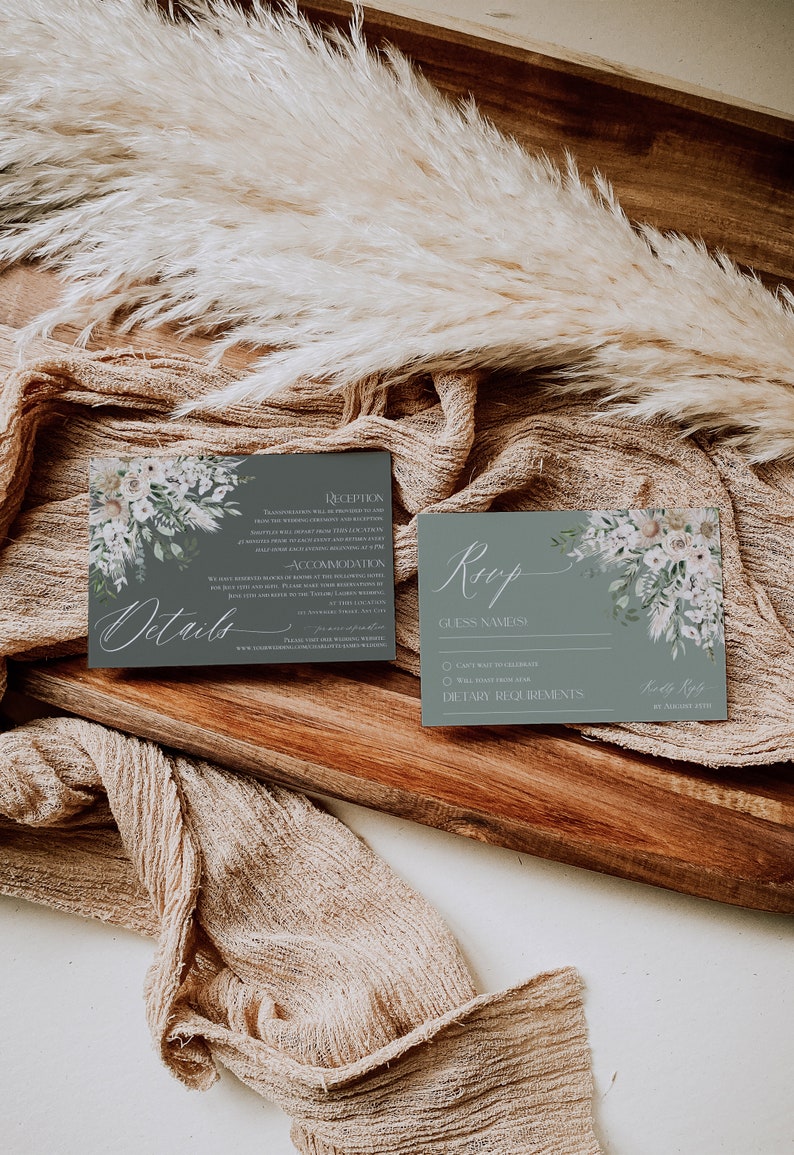 May include: A gray and white wedding RSVP card with a floral design. The card has the text "Roop" in cursive and includes a section for guest names, dietary requirements, and a space for the guest to sign their name.