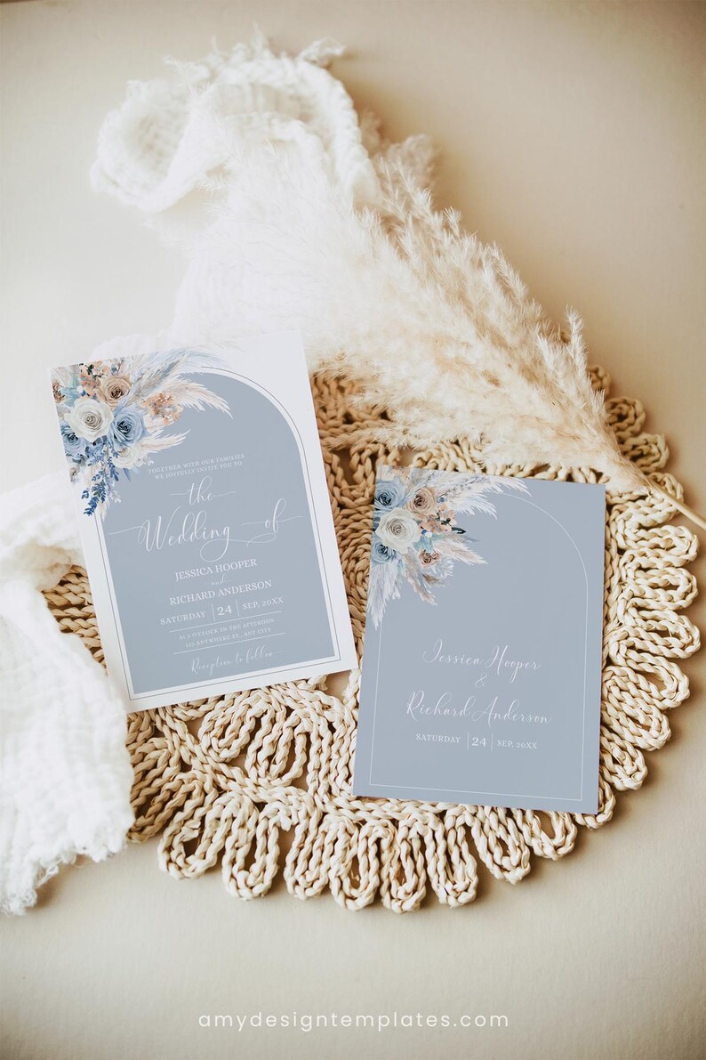 May include: Two wedding invitations with a blue and white floral design. The text on the invitations reads "The Wedding of Jessica Hooper & Richard Anderson" and "Saturday, 24 September".