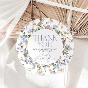May include: Round white thank you tag with a floral border. The tag says "Thank You" and "For making today so special!" with the text "Sarah's Bridal Shower 12.12.20XX" below.