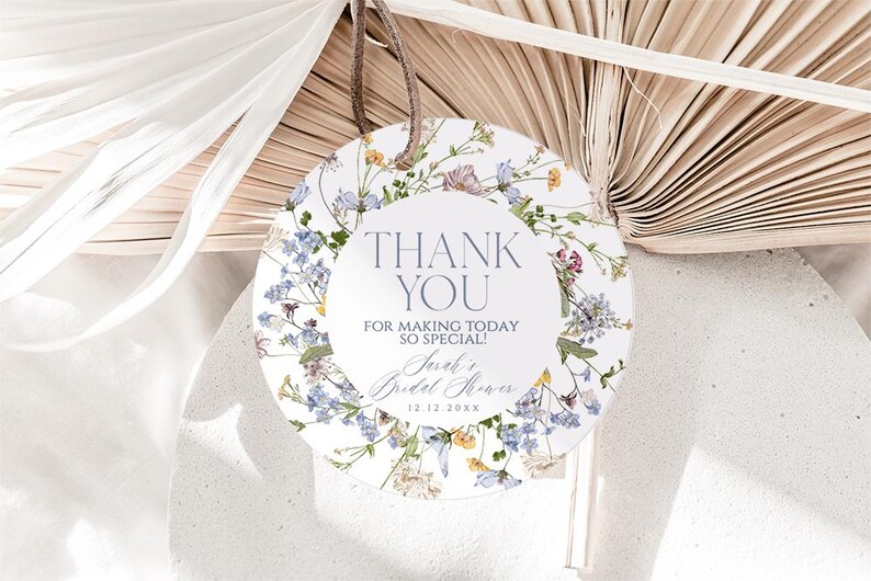 May include: Round white thank you tag with a floral border. The tag says "Thank You" and "For making today so special!" with the text "Sarah's Bridal Shower 12.12.20XX" below.