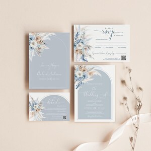 May include: A wedding invitation suite with a blue and white floral design. The invitation features a watercolor illustration of pampas grass and flowers. The text on the invitation reads "The Wedding of Jessica Hooper and Richard Anderson, Saturday, 24th of June".
