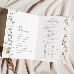 May include: A wedding ceremony program with a floral design. The program includes the order of the ceremony, the wedding party, and a wedding timeline. The text includes the names of the bride and groom, the officiant, the best man, the maid of honor, the bridesmaids, the groomsmen, the flower girls, and the ring bearers.