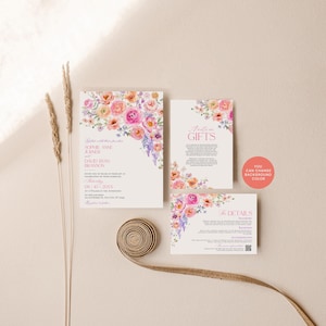 May include: A wedding invitation suite featuring watercolor floral arrangements in pink, orange, and purple. The set includes a main invitation, a gift card, and a details card with text, plus a round coral sticker stating YOU CAN CHANGE BACKGROUND COLOR.