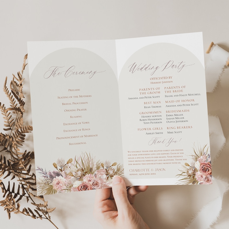 May include: A wedding ceremony program with a floral design featuring pink, white, and green flowers. The program includes the order of the ceremony and the wedding party. The text reads "The Ceremony" and "Wedding Party".