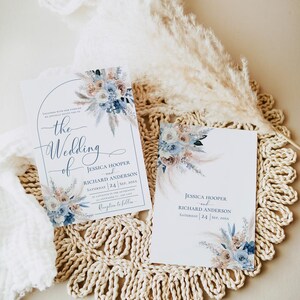 May include: Two wedding invitations with a floral design in shades of blue and beige. The text on the invitations reads "the wedding of Jessica Hooper and Richard Anderson" and "Saturday 24 Sep, 20xx".