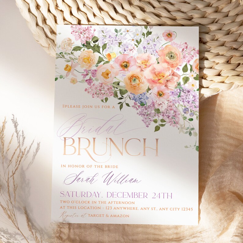 May include: A floral-themed bridal brunch invitation with a watercolor design of pink and purple flowers. The text reads "Please join us for a Bridal Brunch in honor of the bride Sarah William Saturday, December 24th Two o'clock in the afternoon at this location: 123 Anywhere, Any St., Any City 12345 Register at Target & Amazon."