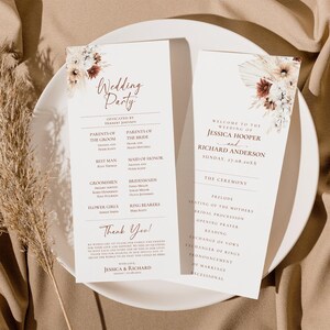May include: Wedding ceremony program with a floral design in shades of brown, white, and beige. The program lists the wedding party, the officiant, and the order of the ceremony. The text reads "Welcome to the Wedding of Jessica Hooper and Richard Anderson, Sunday, 47.08.20XX".