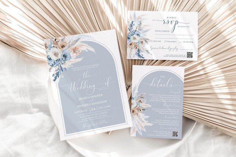 May include: A wedding invitation suite with a blue and white floral design. The invitation features a watercolor illustration of pampas grass and flowers. The text reads "The Wedding of Jessica Hooper and Richard Anderson, Saturday, 24th of June".