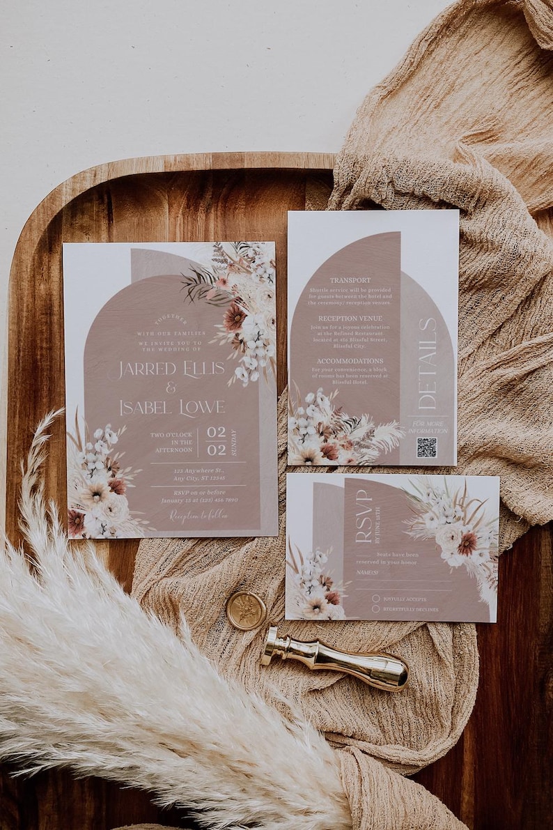 May include: A wedding invitation suite with a brown and white floral design. The invitation features the names "Jarred Ellis & Isabel Lowe" and the date "02.02.2022". The RSVP card includes a QR code.