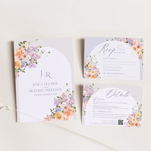 May include: A set of wedding invitation cards with a floral design. The cards are white with a light purple background and feature a watercolor illustration of pink, orange, and purple flowers. The text on the cards reads "Jessica Hooper and Richard Anderson, Sunday, 14th July 2024".
