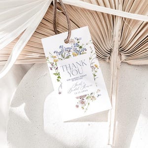 May include: A white thank you card with a floral design and the text "Thank You for making today so special, June's Bridal Shower 12.12.20XX".