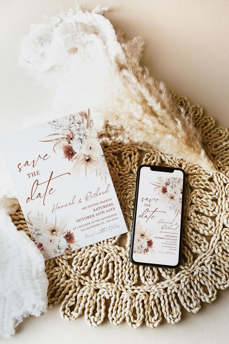 May include: Save the date card with a floral design in shades of brown, white, and cream. The card features the text "Save the Date" in a handwritten font and the names "Hannah & Richard". The date is October 25th, 20XX.