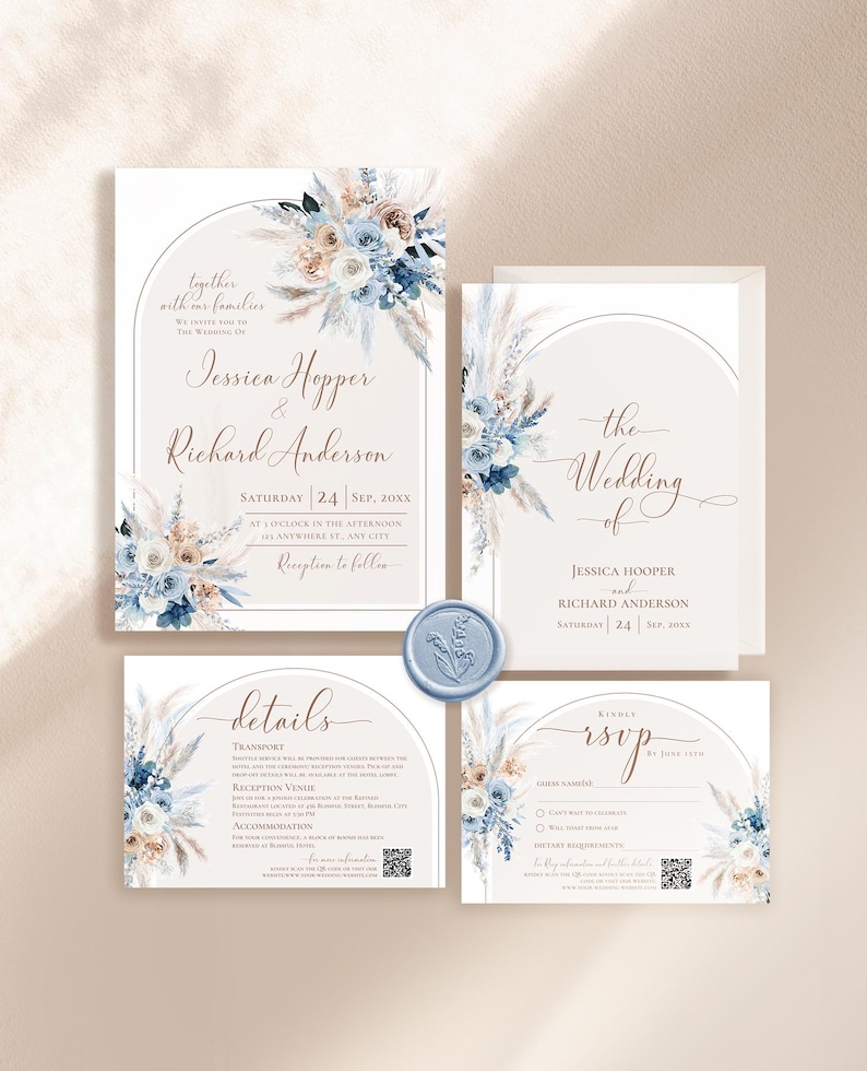 May include: A wedding invitation suite featuring a main invitation, details card, RSVP card, and envelope, all adorned with watercolor blue and beige floral arrangements and pampas grass. A light blue wax seal sits between the cards.