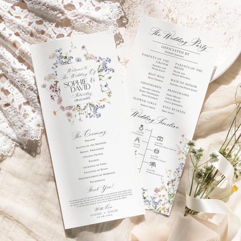 May include: A wedding ceremony program with a floral design featuring blue, pink, and yellow flowers. The program includes the wedding party, ceremony details, and a wedding timeline. The text on the program reads "Welcome to the Wedding of Sophie & David Saturday 08.07.20XX".