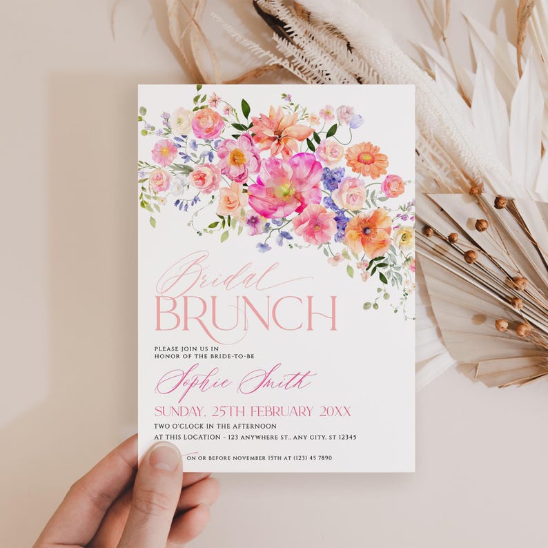May include: A white rectangular invitation card featuring a watercolor floral arrangement in shades of pink, orange, and purple at the top. The text reads Bridal Brunch, Sophie Smith, Sunday, 25th February 20XX, and additional event details.