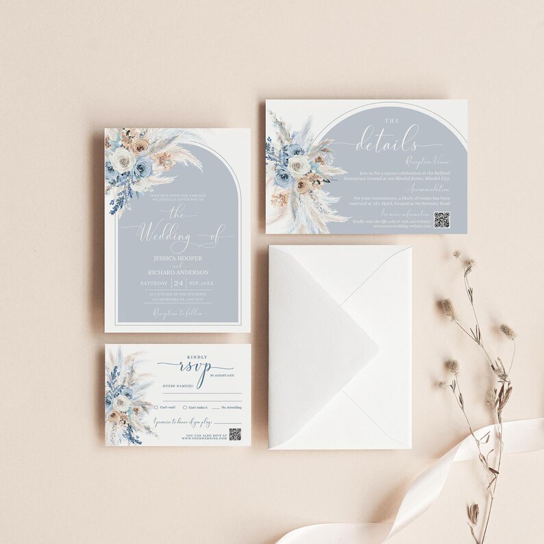 May include: A wedding invitation suite with a blue and white floral design. The invitation features a light blue background with a white arch and the text "The Wedding of" followed by the couple's names and wedding date. The RSVP card features a similar floral design and the text "Kindly RSVP".