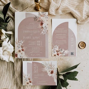 May include: A set of three wedding invitation cards with a floral design. The main card features a peach background with a floral arch and the text "JARRED ELLIS & ISABEL LOWE". The second card has details about the wedding, including the date, time, and location. The third card is an RSVP card with a floral design and a place to indicate attendance.
