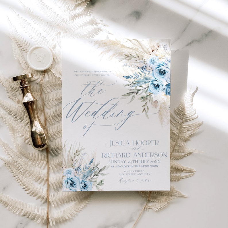 May include: A wedding invitation with a watercolor design featuring blue flowers and greenery. The text reads "Together with our families we joyfully invite you to the wedding of Jesica Hooper and Richard Anderson, Sunday, 24th July 20XX at 1 o'clock in the afternoon, at Anywhere, Any Street, Any City. Reception to follow."