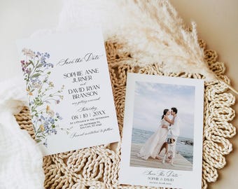 May include: Save the date card with a floral design and the text "Save the Date, Sophie Anne Jurner and David Ryan Branson are getting married, Saturday, 08/10/20XX, at 3 o'clock in the afternoon, 123 Anywhere St., Any City, ST 12345, Final invitations to follow". A second card shows a photo of a couple kissing on a dock with a dog.