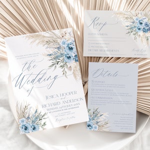 May include: A wedding invitation suite with a blue and white floral design. The invitation features the text "the wedding of Jesica Hooper and Richard Anderson" with the date "Sunday, 24th July 20XX". The RSVP card includes the text "RSVP" and "Guess Names". The details card includes the text "Details" and "Transport".