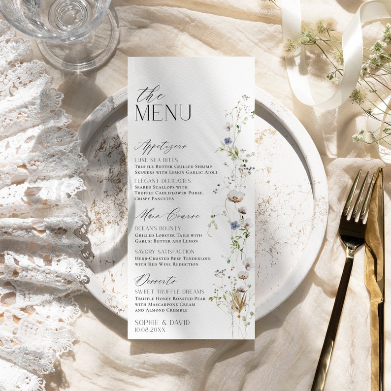 May include: A wedding menu with a floral design. The menu includes appetizers, main course, and desserts. The text on the menu reads: "the MENU", "Appetizers", "LUXE SEA BITES", "TRUFFLE BUTTER GRILLED SHRIMP", "SKEWERS WITH LEMON GARLIC AIOLI", "ELEGANT DELICACIES", "SEARED SCALLOPS WITH", "TRUFFLE CAULIFLOWER PURKE", "CRISPY PANCETTA", "Main Course", "OCEAN'S BOUNTY", "GRILLED LOBSTER TAILS WITH", "GARLIC BUTTER AND LEMON", "SAVORY SATISFACTION", "HERB-CRUSTED BEEF TENDERLOIN", "WITH RED WINE REDUCTION", "Desserts", "SWEET TRUFFLE DREAMS", "TRUFFLE HONEY ROASTED PEAR", "WITH MASCARPONE CREAM", "AND ALMOND CRUMBLE", "SOPHIE & DAVID", "10.08.20XX".