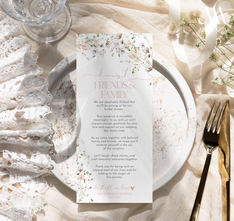 May include: A rectangular bridal shower invitation card featuring a floral border of soft pink and green watercolor flowers. The text reads: Dearest FRIENDS & FAMILY, We are absolutely thrilled that you'll be joining us for our bridal shower.