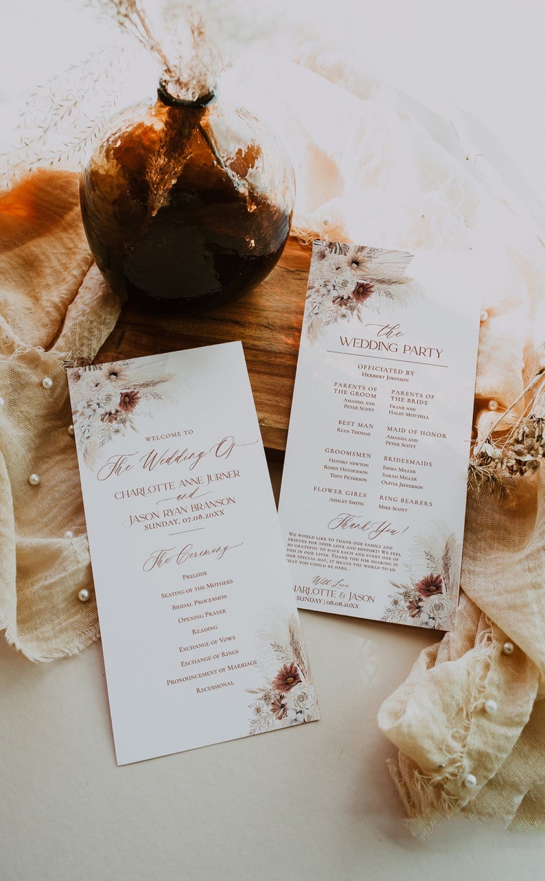 May include: A wedding ceremony order of service and wedding party information card with a floral design. The order of service includes the order of events for the ceremony, including the prelude, seating of the mothers, bridal procession, opening prayer, reading, exchange of vows, exchange of rings, pronouncement of marriage, and recessional. The wedding party card lists the officiant, parents of the bride and groom, best man, groomsmen, maid of honour, bridesmaids, flower girls, and ring bearers.