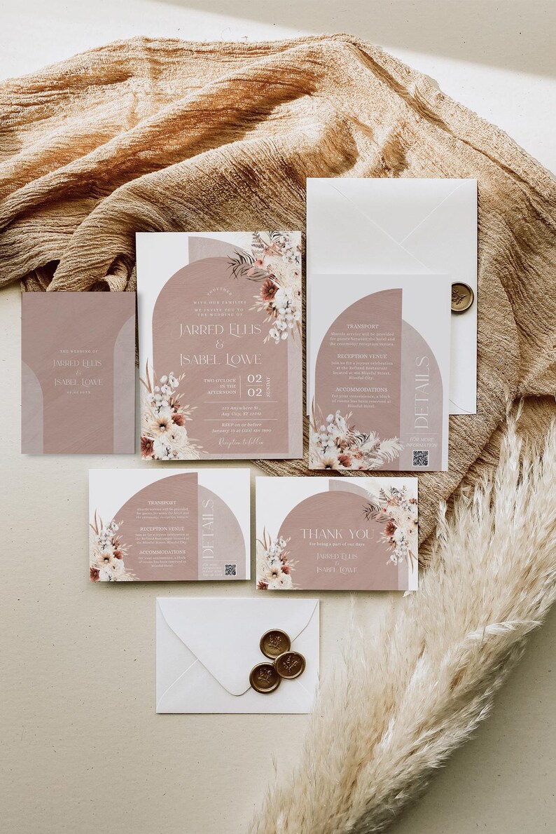 May include: A set of wedding invitations with a blush pink and white floral design. The invitations feature a modern, geometric arch with the text "Jarred Ellis & Isabel Lowe" and the date "July 02, 2023".