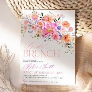 May include: A rectangular invitation card featuring a watercolor floral arrangement in shades of pink, orange, and purple at the top. The text reads Bridal BRUNCH, Sophie Smith, Sunday, 25th February 20XX, and includes event details.