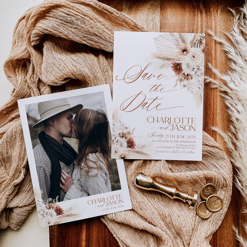 May include: Save the Date card featuring a floral design and a photograph of a couple kissing. The card reads "Save the Date" in cursive script and "Charlotte and Jason" in a serif font. The date is "27th June 202X".